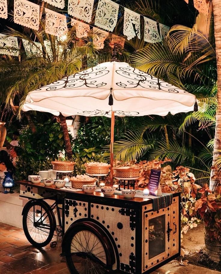 An elegant live food counter at an outdoor catering event